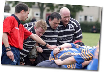 Whos the ref - picture of referee managing rugbby scrum engagement